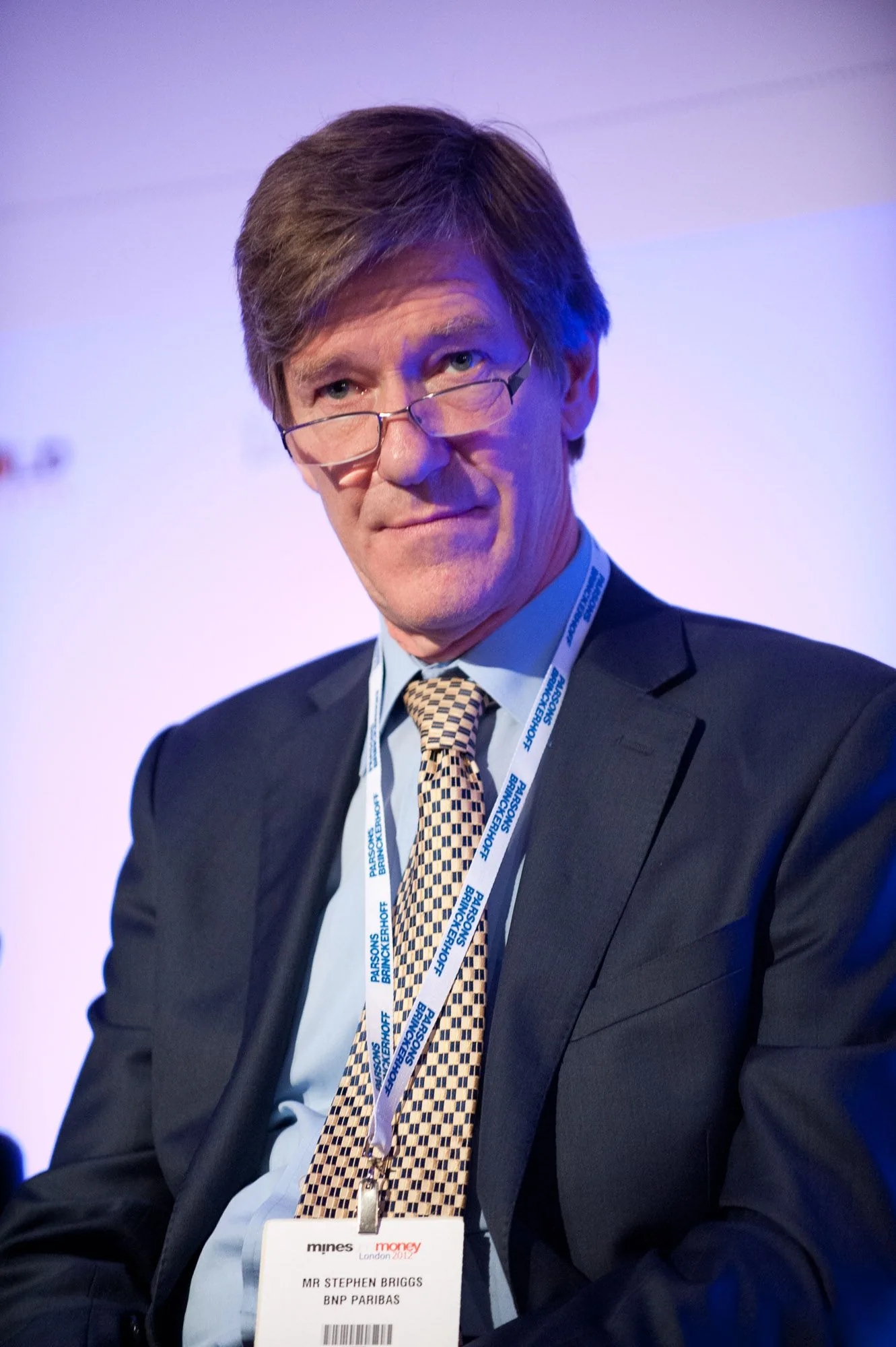 Portrait of a conference delegate wearing a lanyard, corporate event photography by Hector's Eye